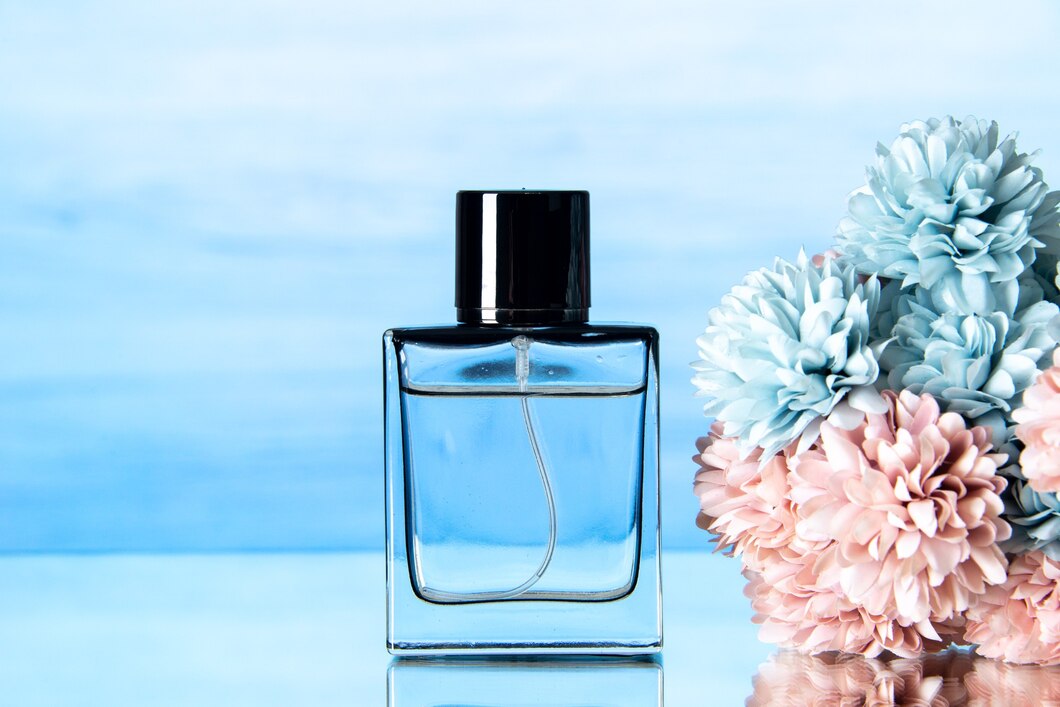 front-view-elegant-perfume-colored-flowers-light-blue-background_140725-145236